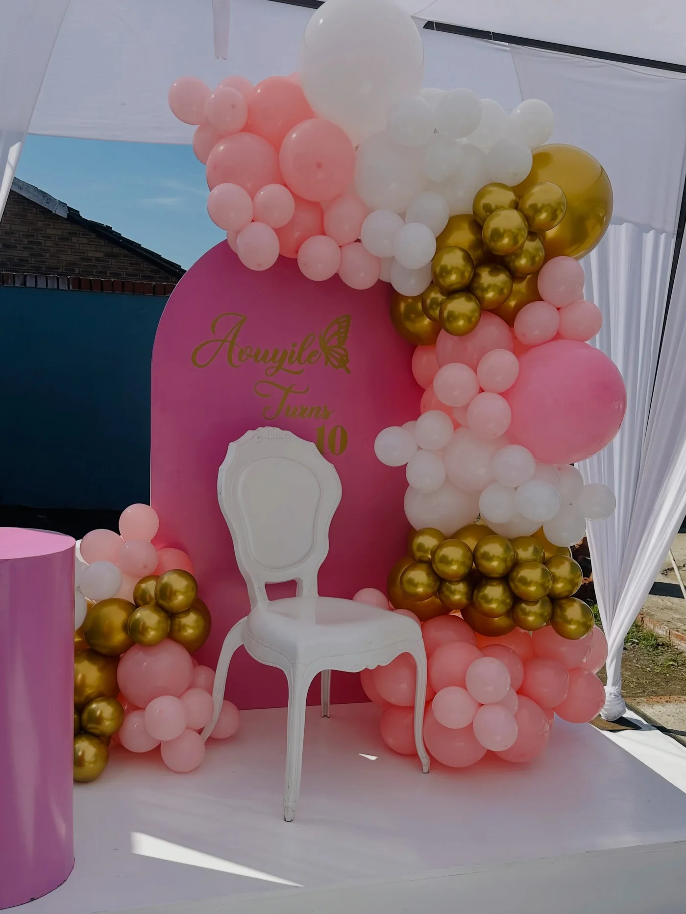 Avuyile turns 10 birthday balloon backdrop in pink, white and gold