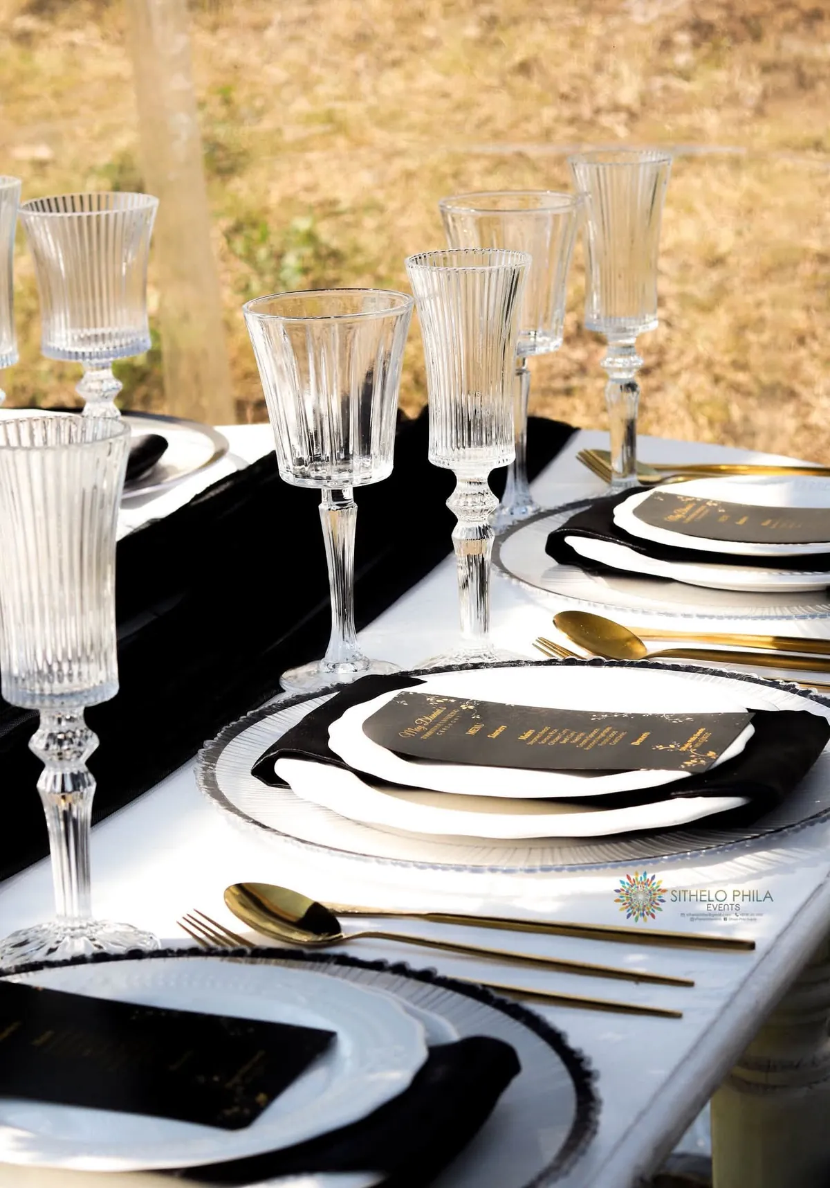 Elegant black, white and gold wedding tablescape styled by Sithelo Phila Events